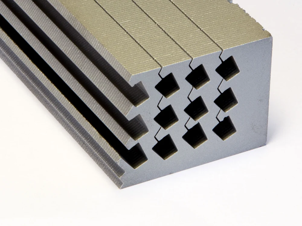 Laminated rare earth magnet stack showing custom material geometry
